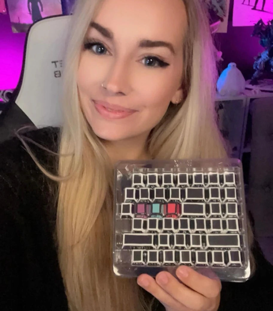 Gaming influencer @liteweightgaming holds up her GPBT Sketch keycaps